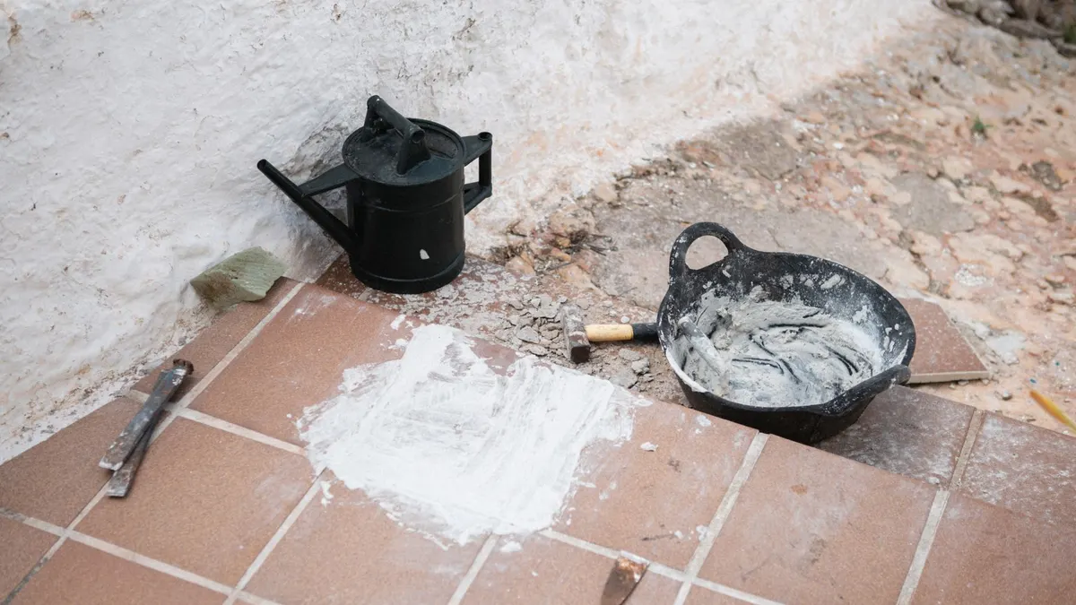 Construction tools and materials on tiled floor, Ciutadella de Menorca, Balearic Islands.